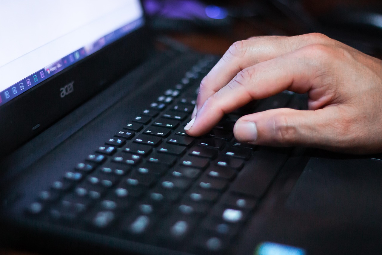 Internet surfing, hand, laptop — The Advantages of Using an Expert Service for Review Removal